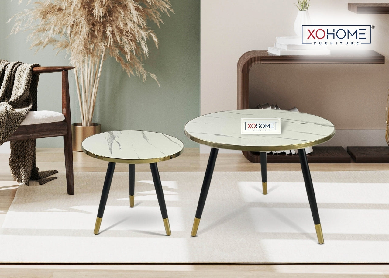 XOHOME Zara Set of 2 coffee tables. It consists of a glass top finished in marble touch. Top is white in color.