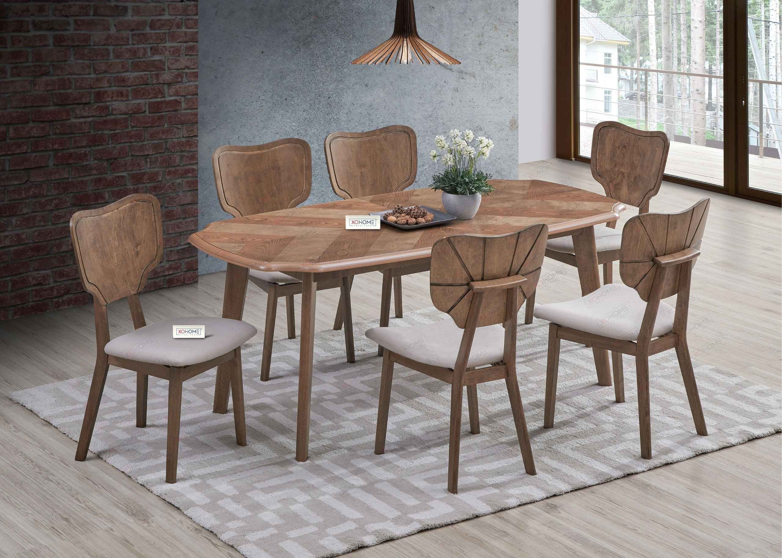 XOHOME Saumya 6-Seater Dining Set in Pure Solidwood, featuring a curved tabletop with elegant pattern detailing and thickly padded modern chairs – perfect for luxury dining interiors.