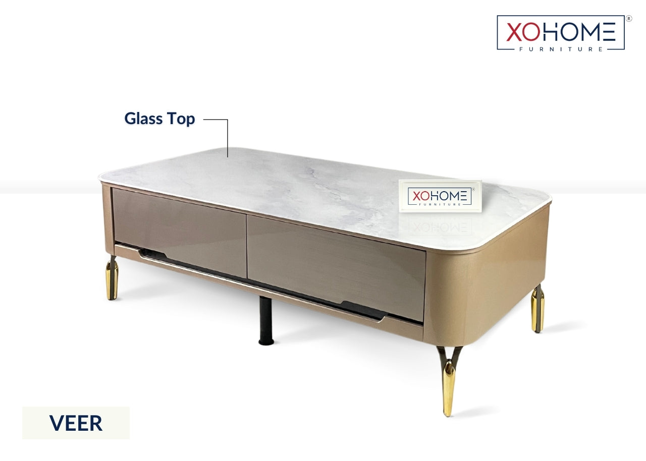 XOHOME Veer Glass top coffee table with 4 storage drawers. The glass top completely looks like a marble.