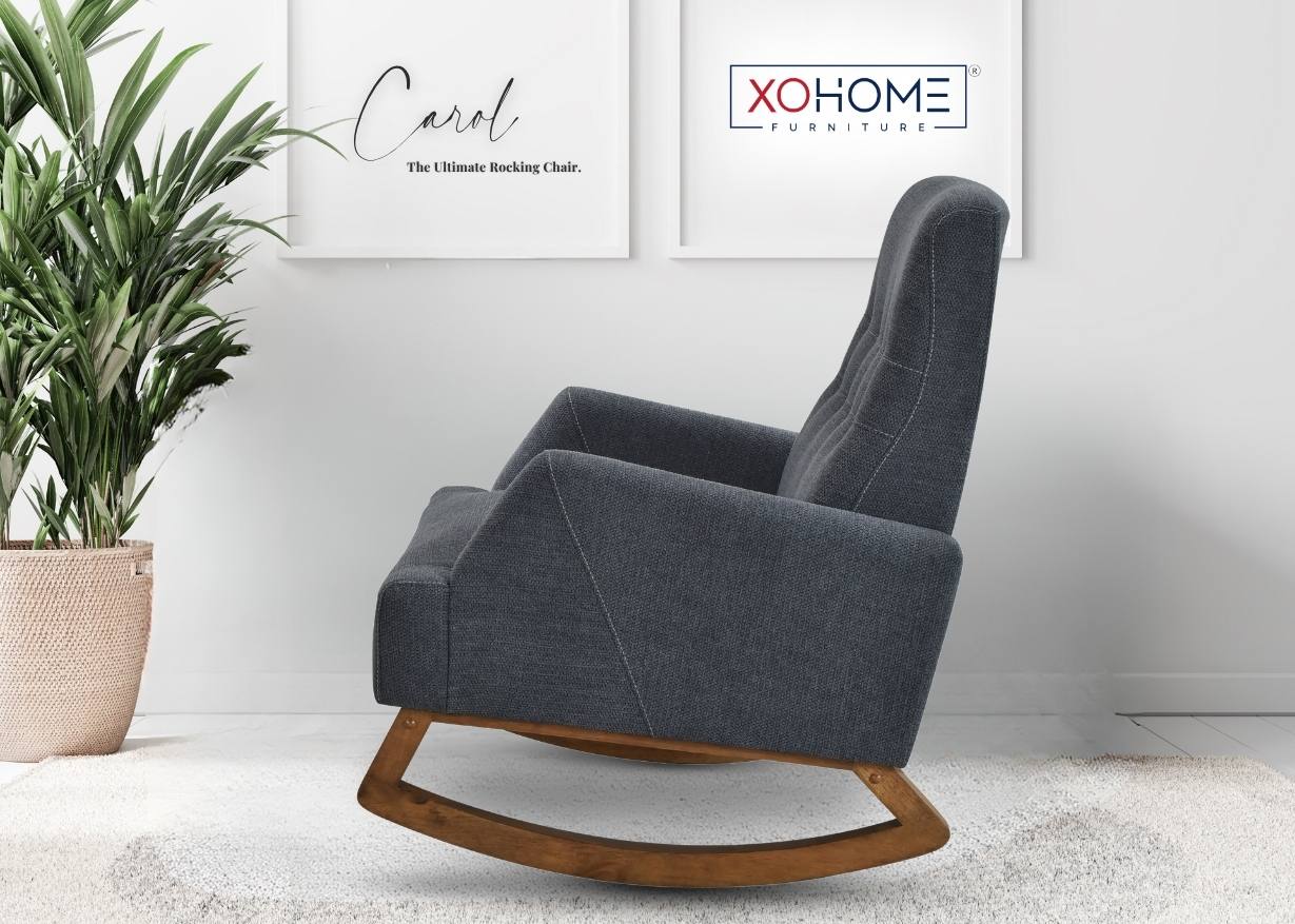 Carol Rocking Chair in charcoal finish placed sideways in a posh living room setting, highlighting its graceful silhouette.