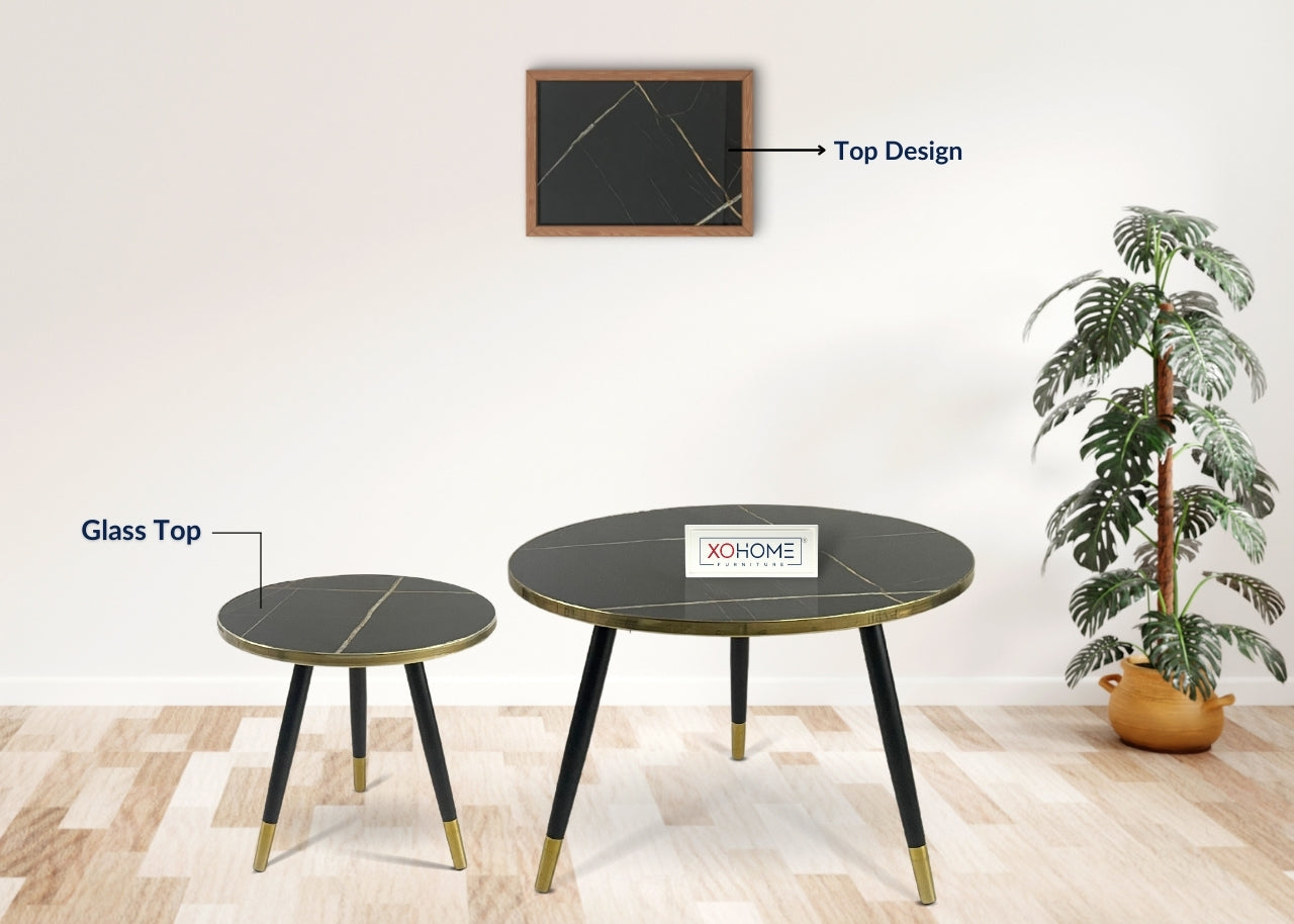 XOHOME Zara Set of 2 coffee tables. It consists of a glass top finished in marble touch. Top is Black in color.