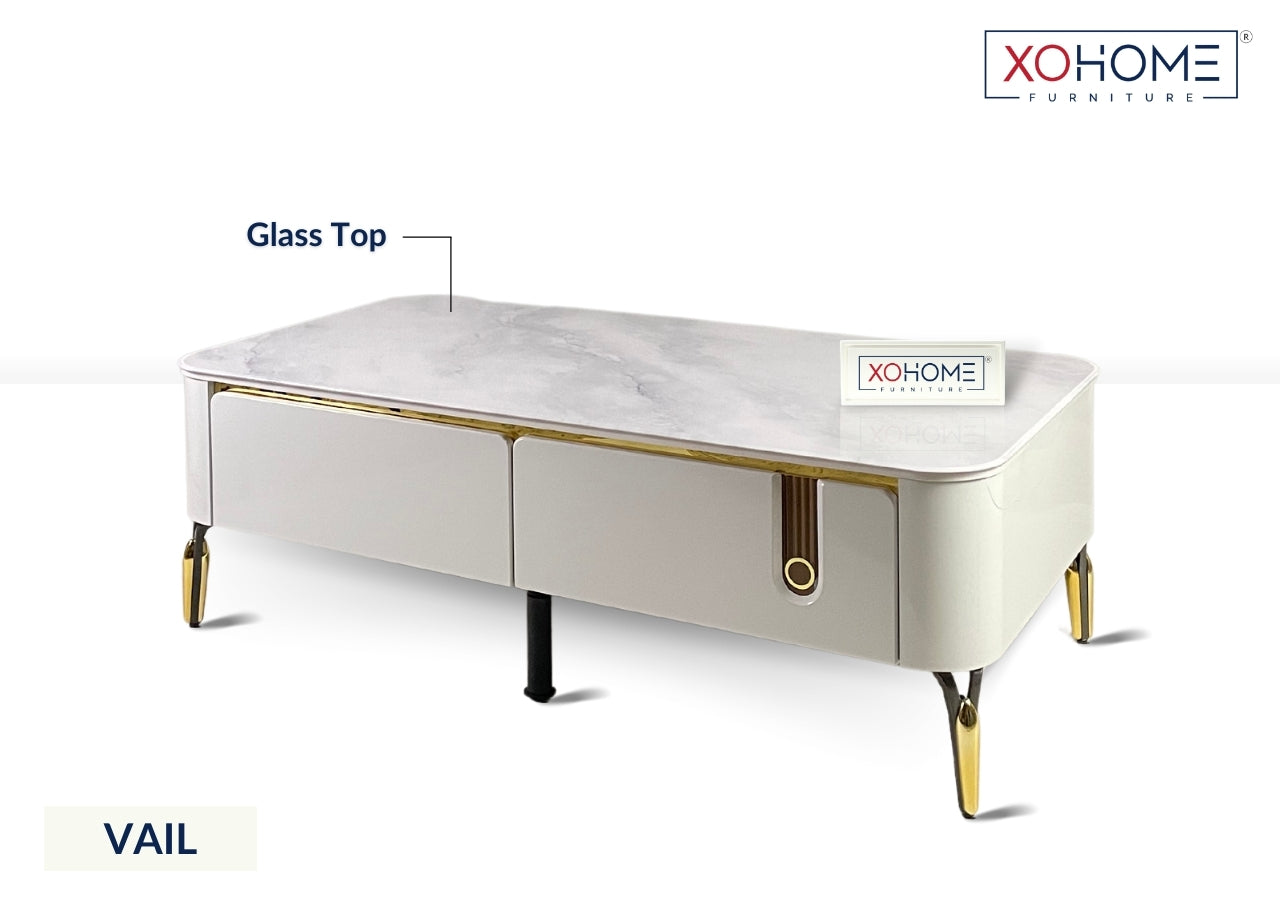 XOHOME Vail Glass top coffee table with 4 storage drawers. The glass top completely looks like a marble. 