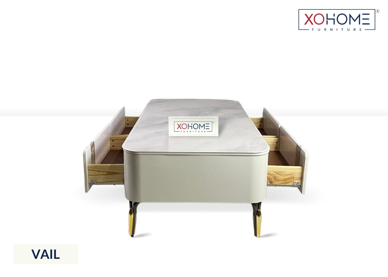 XOHOME Vail Glass top coffee table with 4 storage drawers. The glass top completely looks like a marble. 