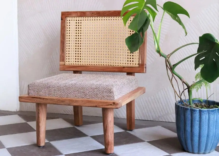 BHUMI handcrafted pure solidwood low seating chair with natural rattan backrest and soft feather-touch cushion, premium wooden floor chair for mandir, living room and balcony decor.