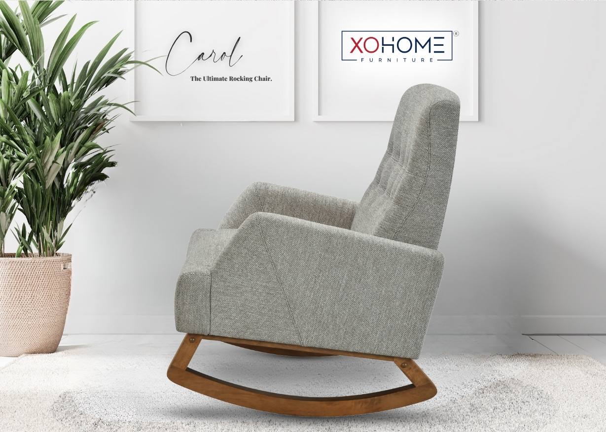 Carol Rocking Chair in earth brown finish placed sideways in a posh living room setting, highlighting its graceful silhouette.