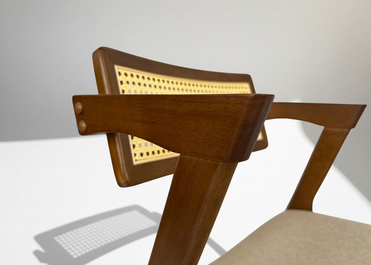 Wooden chair with a woven backrest on a white background